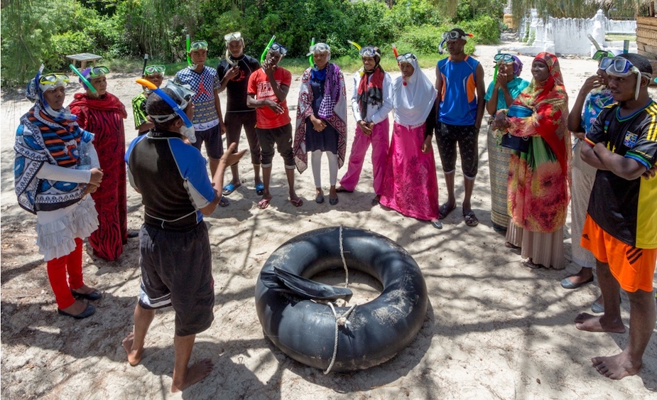 A park ranger preparing local villagers for snorkelling in the Chumbe reef.