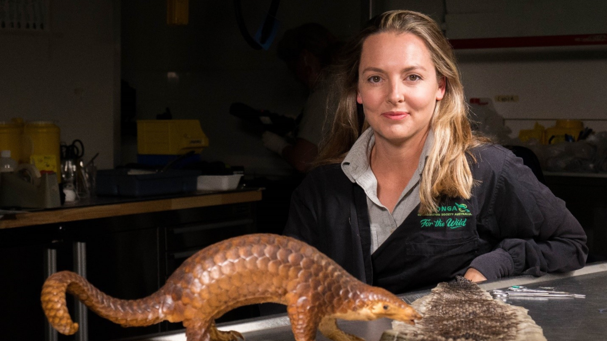 A wildlife conservation officer posing for a portrait in the post-mortem room.