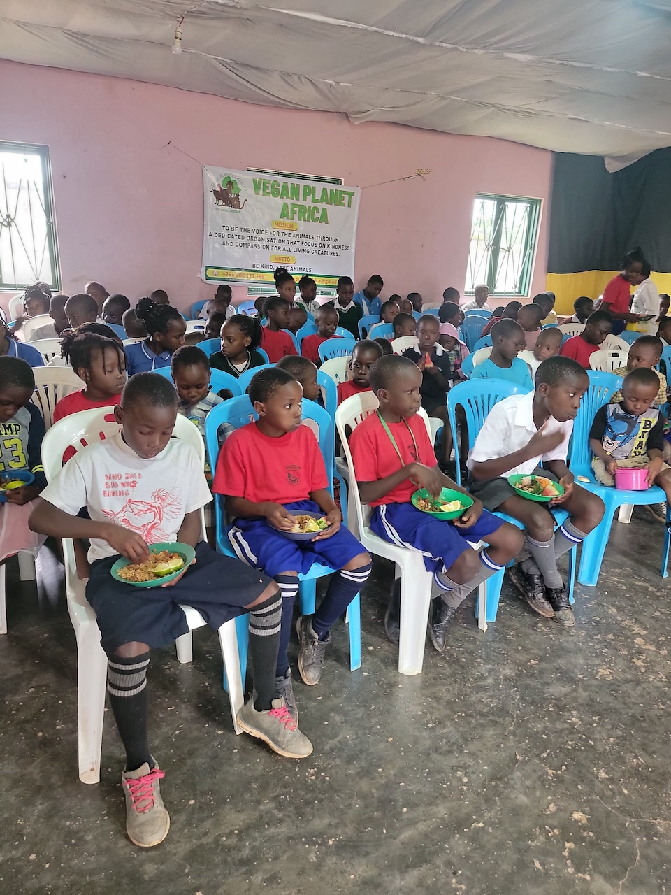 Primary school children enjoying vegan plant-based foods during an educational drive at the local primary school, promoting healthy eating and sustainability.