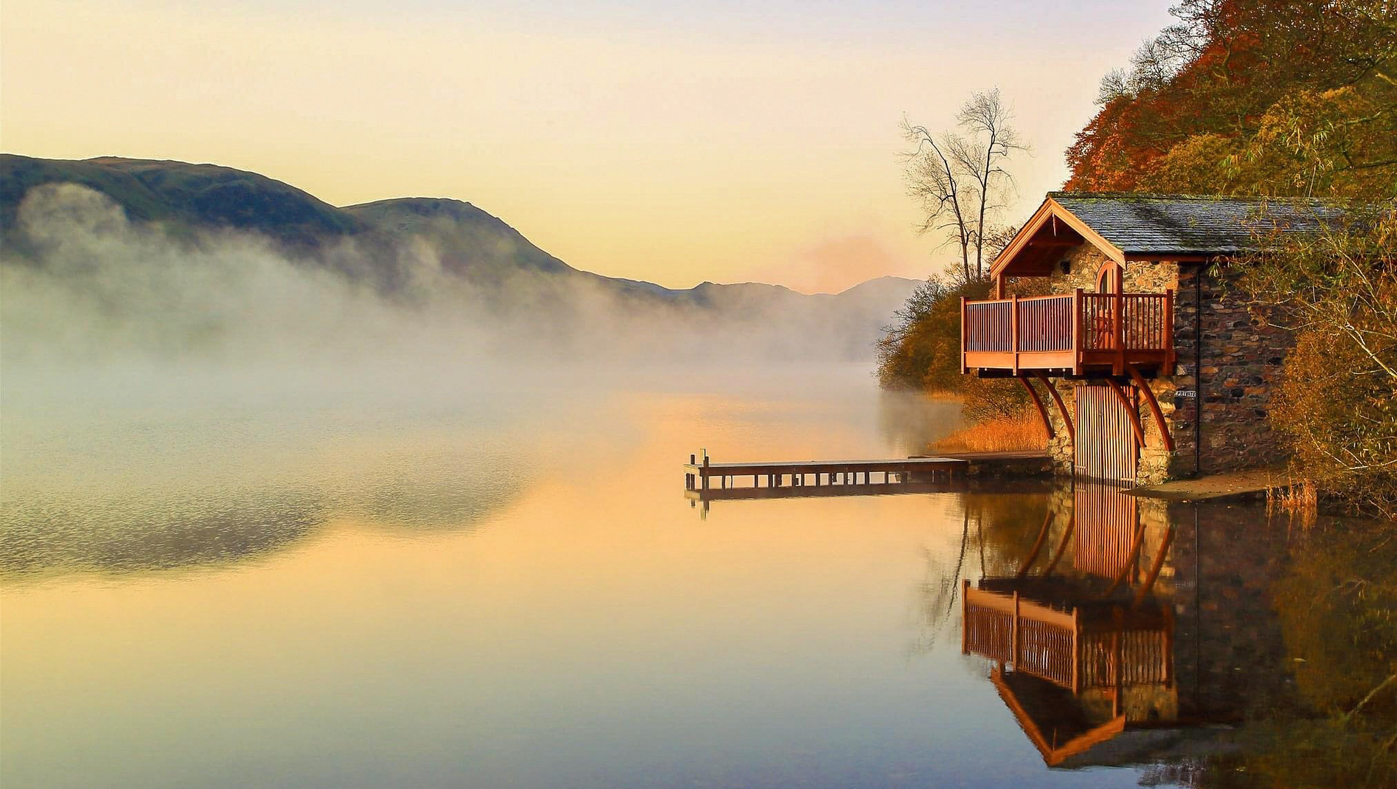 A boathouse and early morning mist over a still lake in the Lake District, UK. As a conservation officer, you might work in some of the world's most beautiful landscapes.
