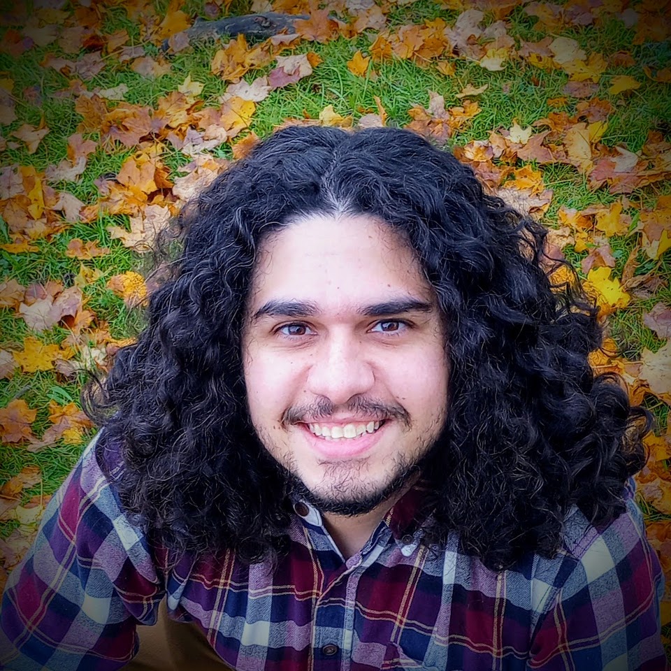 Headshot of Dr. Iury Simoes-Sousa. He is looking at the camera and smiling.