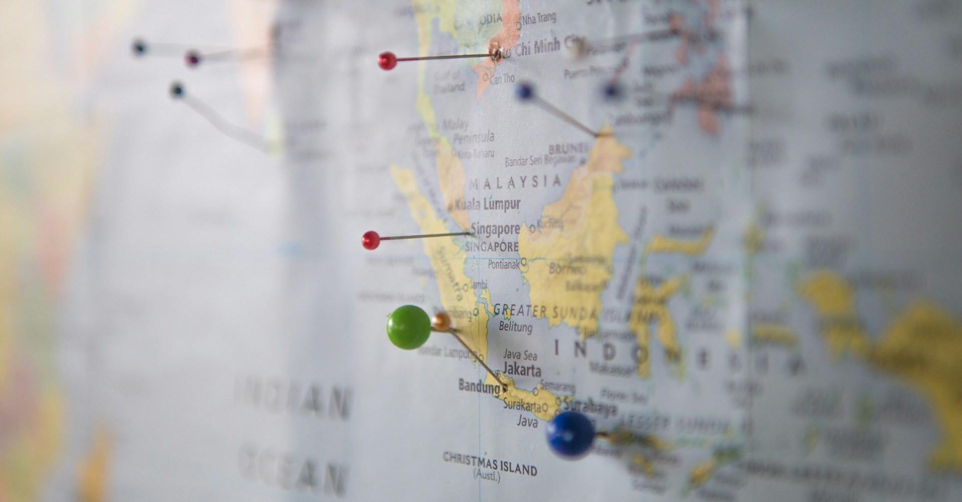 A map with coloured pins in it showing Indonesia in the foreground.