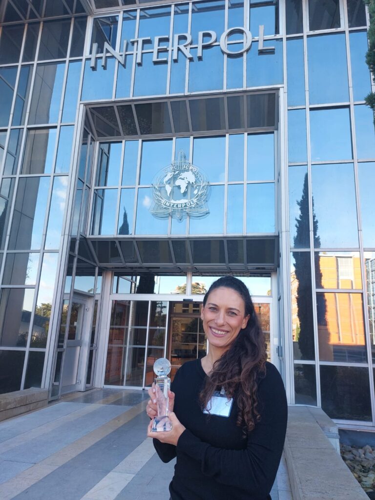 Juliana with her Interpol prize “Partnerships in Conservation Award” (2023)