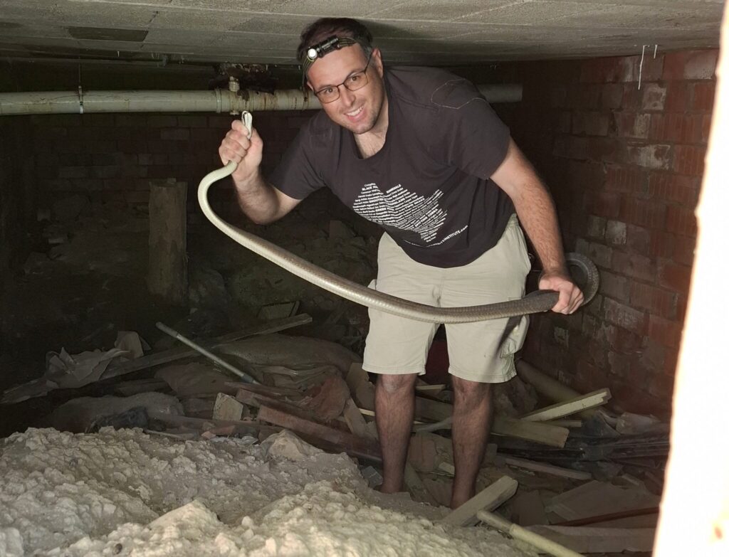 ick Evans with a rescued Southern African python. Nick has helped shift public perceptions of snakes from fear and misunderstanding toward appreciation