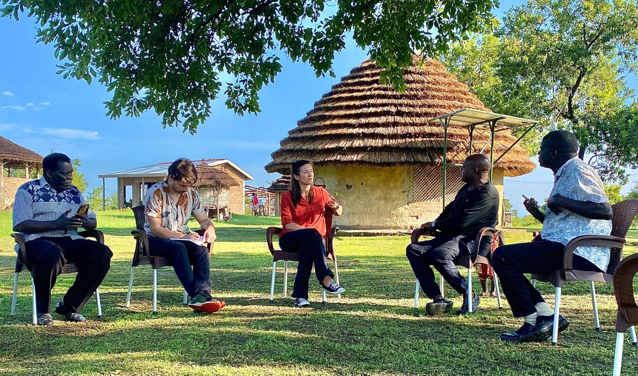 Community engagement session in Uganda during a feasibility assessment.